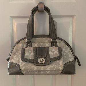 Gray and white Coach handbag